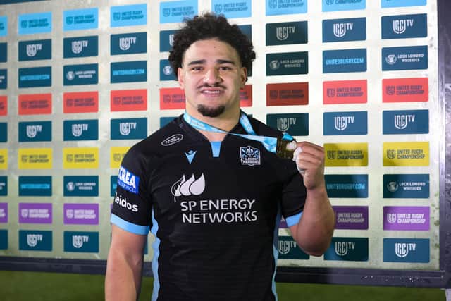 Sione Tuipulotu with his player of the match award after the win over Ospreys. (Photo by Craig Williamson / SNS Group)