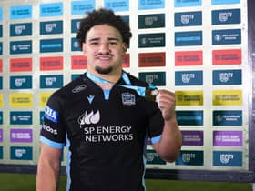 Sione Tuipulotu with his player of the match award after the win over Ospreys. (Photo by Craig Williamson / SNS Group)