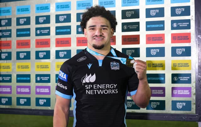 Sione Tuipulotu with his player of the match award after the win over Ospreys. (Photo by Craig Williamson / SNS Group)