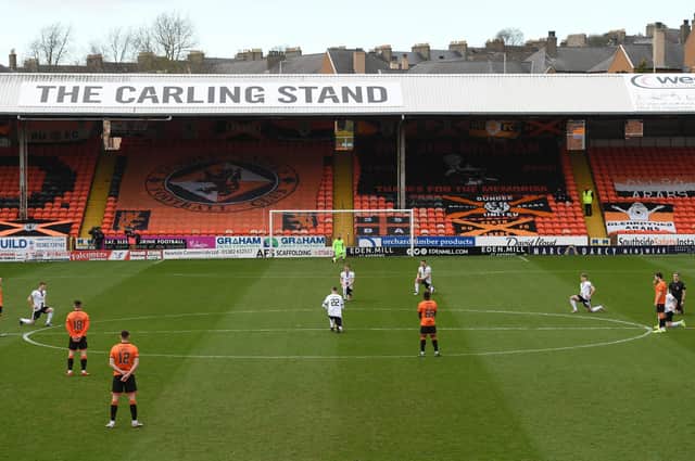 Dundee United players make a stand against racism instead of taking a knee before their 1-0 win over Aberdeen at Tannadice (Photo by Craig Foy / SNS Group)