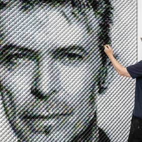 Artist Joe Black adds the finishing touches to a portrait of David Bowie made from over 8,500 guitar plectrums, commissioned by Sky Arts to celebrate Bowie topping a new definitive list of Britain's 50 most influential artists of the past 50 years