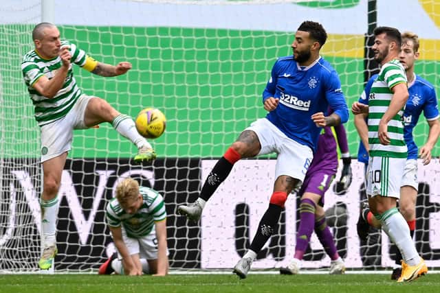 Celtic's Scott Brown (left) and battles with Rangers' two-goal matchwinner Connor Goldson (Photo by Rob Casey / SNS Group)
