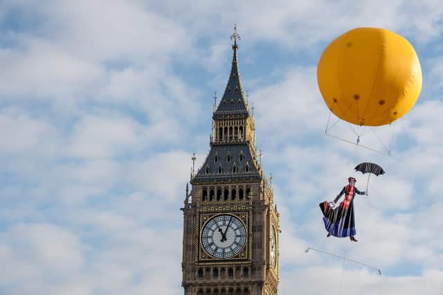 Mary Poppins floats by the Houses of Parliament (Picture: Chris J Ratcliffe/Getty Images)