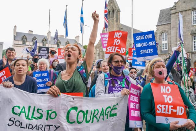 Members of the campaign group For Women Scotland demonstrate outside the Scottish Parliament at Holyrood in Edinburgh.