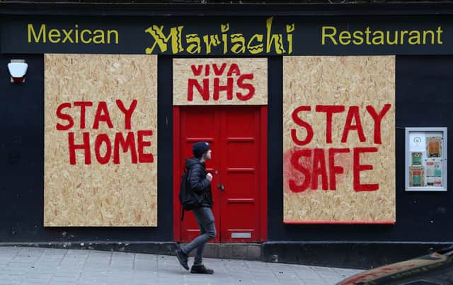 A boarded-up restaurant in Edinburgh has been painted with a message supporting the NHS as the lockdown continues (Picture: Andrew Milligan/PA Wire)