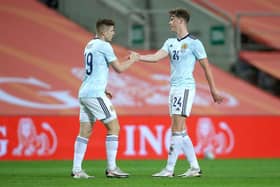 Jack Hendry, right, congratulates Kevin Nisbet after the latter's goal for Scotland against the Netherlands on Wednesday night. Picture: Getty