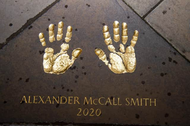 Mr McCall Smith was also reunited with a set of his hand-prints preserved in stone in the City Chambers quadrangle.