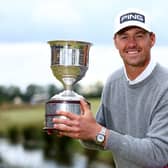 Victor Perez celebrates with the trophy after winning a four hole play-off against Ryan Fox of New Zealand to clinch the Dutch Open at Bernardus Golf. (Photo by Dean Mouhtaropoulos/Getty Images)
