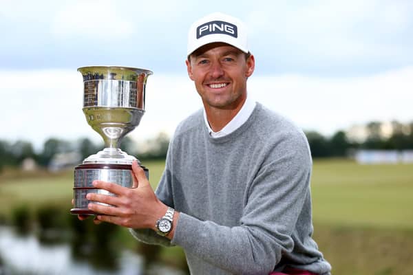 Victor Perez celebrates with the trophy after winning a four hole play-off against Ryan Fox of New Zealand to clinch the Dutch Open at Bernardus Golf. (Photo by Dean Mouhtaropoulos/Getty Images)
