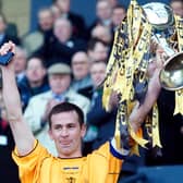 Stuart Lovell lifts the League Cup after Livingston's win over Hibs in the 2004 final. Picture: Alan Harvey/SNS