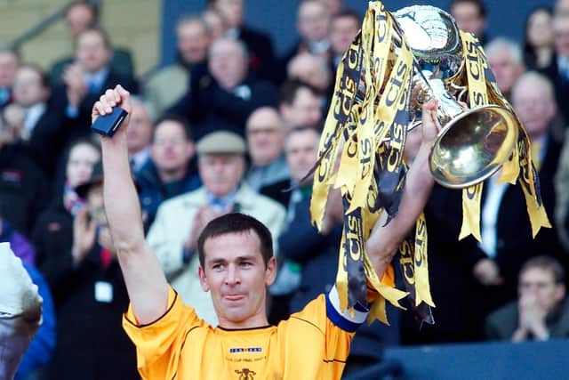 Stuart Lovell lifts the League Cup after Livingston's win over Hibs in the 2004 final. Picture: Alan Harvey/SNS