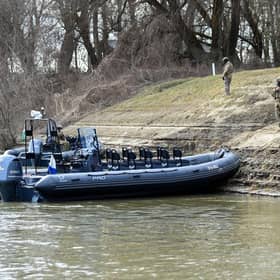 Hungarian soldiers patrol the banks of the Tysa river, near the Hungary-Ukraine border village of Lonya, in the early days of the Russia-Ukraine conflict.