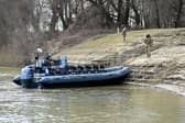 Hungarian soldiers patrol the banks of the Tysa river, near the Hungary-Ukraine border village of Lonya, in the early days of the Russia-Ukraine conflict.