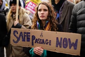 People take part in a protest outside Downing Street in Westminster.