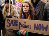 People take part in a protest outside Downing Street in Westminster.