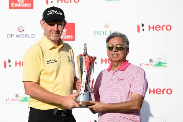 Stephen Gallacher receives the trophy from Dr Pawan Munjal, chairman and CEO of of Hero MotoCorp, after his win in 2019 - the last time it was staged. Picture: Ross Kinnaird/Getty Images.