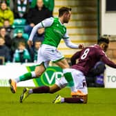 Hibs striker Marc McNulty challenges Hearts defender Sean Clare during the Edinburgh derby at Easter Road on March 3, 2020. (Photo by Ross Parker / SNS Group)