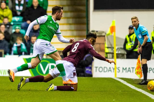 Hibs striker Marc McNulty challenges Hearts defender Sean Clare during the Edinburgh derby at Easter Road on March 3, 2020. (Photo by Ross Parker / SNS Group)