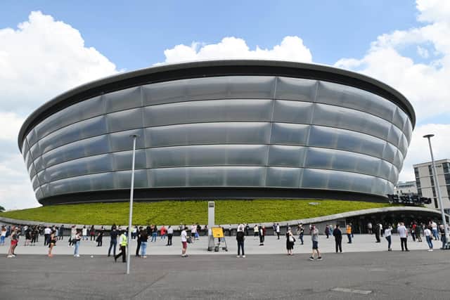 People wait for a Covid vaccine appointment at the SSE Hydro earlier in June. Picture: John Devlin