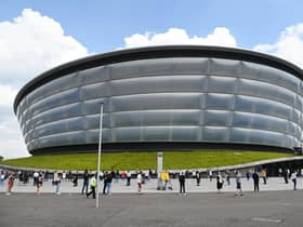 People wait for a Covid vaccine appointment at the SSE Hydro earlier in June. Picture: John Devlin