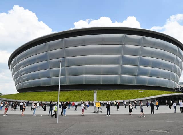 People wait for a Covid vaccine appointment at the SSE Hydro earlier in June. Picture: John Devlin