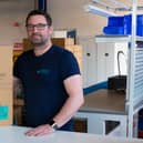 Service and installation manager Kris Aitchison with a packaged SolarisKit collector. Picture: contributed.