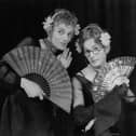 Patrick Fyffe (1942 - 2002, left), aka Dame Hilda Bracket, and George Logan (right), aka Dr Evadne Hinge, who died on Sunday performing in 1975. (Photo by Keystone Features/Hulton Archive/Getty Images)
