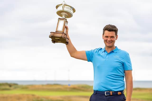 Craigielaw's Angus Carrick with the trophy after his win in the Scottish Amateur Championship at Murcar Links. Picture: Scottish Golf.
