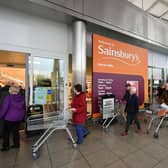 Shoppers queue outside a branch of Sainsbury's during the first lockdown in March 2020. Picture: Dan Mullan/Getty Images