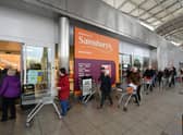 Shoppers queue outside a branch of Sainsbury's during the first lockdown in March 2020. Picture: Dan Mullan/Getty Images