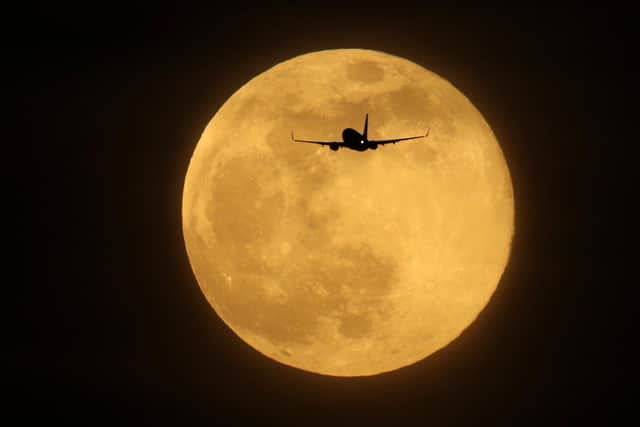 Supermoons appear bigger and brighter in the sky because they are slightly closer to the Earth (Getty Images)