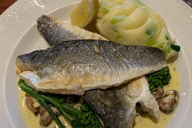 Menu highlights include grilled sea bass with leek mash, smoked mussel broth and sprouting broccoli.