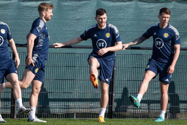 Scotland captain Andy Robertson (centre) with Stuart Armstrong (left) and Ryan Jack (right) during a training session at Oriam in Edinburgh on Monday. (Photo by Paul Devlin / SNS Group)