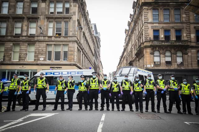 Police form a line at the protests in George Square in Glasgow. on Sunday. Picture: Jane Barlow/PA Wire