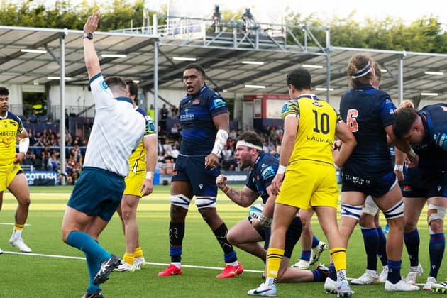 Ewan Ashman, centre with headband, clenches his fist to celebrate the second of his two tries in Edinburgh's 40-14 win over Zebre Parma at Hive Stadium. (Photo by Paul Devlin / SNS Group)