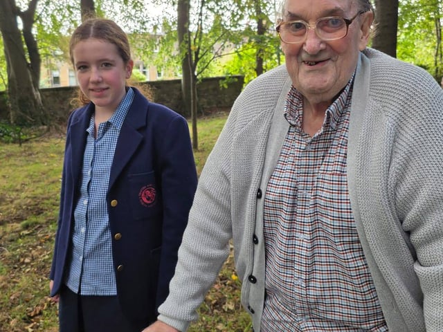 Child from St George’s School and resident from HC-One Scotland’s Murrayfield House Care Home taking a walk