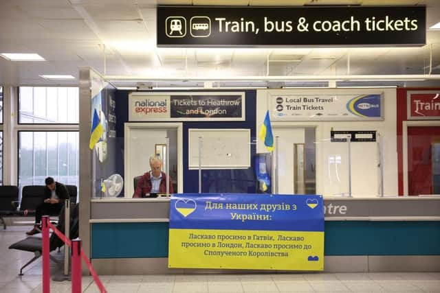 A desk at the international arrivals gate set up to assist Ukrainian refugees at Gatwick Airport.