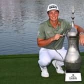 Viktor Hovland poses with the Dallah Trophy after his victory in the Slync.io Dubai Desert Classic at Emirates Golf Club. Picture: Ross Kinnaird/Getty Images.