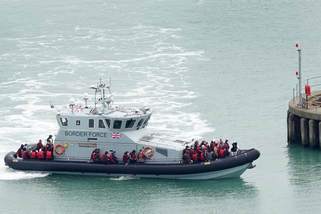 A group of people thought to be migrants are brought in to Dover, Kent, onboard a Border Force vessel, following a small boat incident in the Channel. Picture: Gareth Fuller/PA Wire