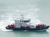 A group of people thought to be migrants are brought in to Dover, Kent, onboard a Border Force vessel, following a small boat incident in the Channel. Picture: Gareth Fuller/PA Wire