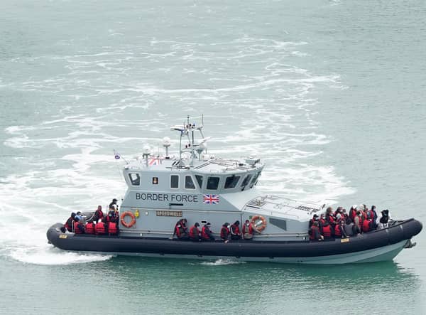 A group of people thought to be migrants are brought in to Dover, Kent, onboard a Border Force vessel, following a small boat incident in the Channel. Picture: Gareth Fuller/PA Wire