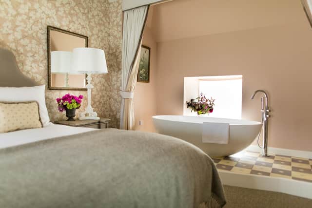 The Catriona one bedroom cottage features a free standing bathtub and an adjacent Louis XIV style dressing room.