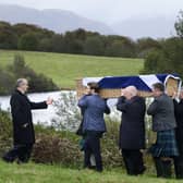 Mourners carrying the coffin of Ian Hamilton KC to his burial in a plot in the grounds of his old house at Loch Na Beithe, North Connel