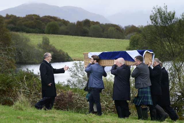 Mourners carrying the coffin of Ian Hamilton KC to his burial in a plot in the grounds of his old house at Loch Na Beithe, North Connel