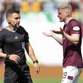 Nick Walsh sent off Alex Cochrane for a foul on Daizen Maeda.  (Photo by Ross Parker / SNS Group)