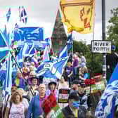 Supporters of Scottish independence march over the Auld Brig on their way to the site of the Battle of Bannockburn (Picture: Jane Barlow/PA)