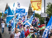 Supporters of Scottish independence march over the Auld Brig on their way to the site of the Battle of Bannockburn (Picture: Jane Barlow/PA)