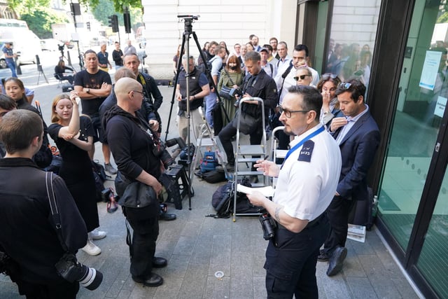 Member of the security team at Westminster Magistrates Court in London, speaks to the media ahead of the arrival of actor Kevin Spacey who is charged with sexual offences against three men.