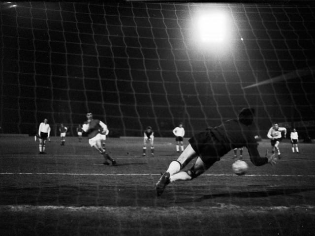 Joe Davis scores Hibs' second goal against Clyde under the floodlights at Easter Road in March 1966.