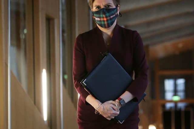 First Minister Nicola Sturgeon wearing a face covering at Holyrood. Picture: Fraser Bremner/POOL/AFP via Getty Images